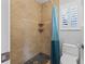 Bathroom featuring tiled shower, pebble floor, and built-in corner shelves at 114 Valencia Loop, Altamonte Springs, FL 32714