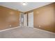 Neutral bedroom featuring tile flooring, tan colored walls and entry to the rest of the home at 114 Valencia Loop, Altamonte Springs, FL 32714