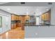 Modern kitchen with wood cabinets, stainless steel appliances, and a breakfast bar at 114 Valencia Loop, Altamonte Springs, FL 32714