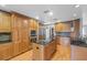 Contemporary kitchen with stainless steel appliances, custom cabinetry, and granite counters at 114 Valencia Loop, Altamonte Springs, FL 32714