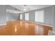 Bright and airy living room featuring hardwood floors, ceiling fan and natural light at 114 Valencia Loop, Altamonte Springs, FL 32714