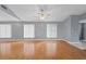 Bright living room featuring hardwood floors, neutral walls, and natural light from multiple windows at 114 Valencia Loop, Altamonte Springs, FL 32714