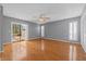 Living room with hardwood floors and sliding glass doors leading to the outdoor patio at 114 Valencia Loop, Altamonte Springs, FL 32714