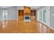 Open living room featuring hardwood floors, a fireplace and patio access at 114 Valencia Loop, Altamonte Springs, FL 32714