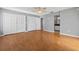 Spacious main bedroom featuring hardwood floors, large closets, and an ensuite bathroom at 114 Valencia Loop, Altamonte Springs, FL 32714