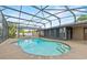 View of private pool with brick coping and screened enclosure at 114 Valencia Loop, Altamonte Springs, FL 32714