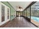 View of covered patio area with brick flooring and enclosed view of pool area at 114 Valencia Loop, Altamonte Springs, FL 32714