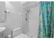 Shower with modern fixtures, white tiled walls, and patterned shower curtain at 114 Valencia Loop, Altamonte Springs, FL 32714