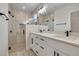 Modern bathroom with double vanity, quartz countertop, and glass-enclosed shower at 16538 Sw 31St Terrace, Ocala, FL 34473
