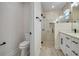 Elegant bathroom with toilet, glass-enclosed shower, and double vanity at 16538 Sw 31St Terrace, Ocala, FL 34473