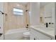Bathroom featuring tub, tile walls, and bright vanity at 16538 Sw 31St Terrace, Ocala, FL 34473