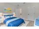 Bright bedroom features white trim, light-colored laminate flooring and modern decor at 16538 Sw 31St Terrace, Ocala, FL 34473