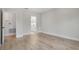 Clean and well-lit empty room with wood-look flooring at 16538 Sw 31St Terrace, Ocala, FL 34473