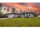 Charming single-story home featuring a neutral color palette, well-manicured lawn, and attached two car garage at 16538 Sw 31St Terrace, Ocala, FL 34473