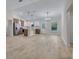 Open-concept kitchen with modern stainless steel appliances, a center island, and ample natural light at 16538 Sw 31St Terrace, Ocala, FL 34473