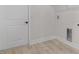A well lit laundry room featuring crisp white paint, modern flooring, and plenty of space at 16538 Sw 31St Terrace, Ocala, FL 34473
