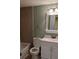 Bathroom featuring tiled shower, toilet, vanity with cabinet, and square framed mirror at 2500 21St Nw St # 71, Winter Haven, FL 33881