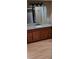 Bathroom features wood vanity, granite counter, and traditional fixtures at 2500 21St Nw St # 71, Winter Haven, FL 33881