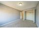 Bedroom features neutral paint, plush carpet, and a closet with open doors at 2500 21St Nw St # 71, Winter Haven, FL 33881