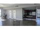 Clubhouse interior view showing kitchenette, storage, and access to an outdoor balcony overlooking the lake at 2500 21St Nw St # 71, Winter Haven, FL 33881