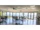 A community room with abundant windows and a lake view at 2500 21St Nw St # 71, Winter Haven, FL 33881
