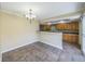 Cozy dining area featuring decorative lighting, and views into the breakfast bar and kitchen at 2500 21St Nw St # 71, Winter Haven, FL 33881