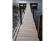 This is a wooden dock with railings leading to a platform overlooking the lake at 2500 21St Nw St # 71, Winter Haven, FL 33881