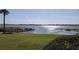 Enjoy the lake view from the grassed property with a palm tree at 2500 21St Nw St # 71, Winter Haven, FL 33881