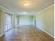 Open-concept living room with tile flooring, natural light, and neutral paint. Ready for personal touches at 2500 21St Nw St # 71, Winter Haven, FL 33881