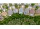 Overhead shot of home with screened pool, nestled between other homes and large green space at 10292 Kristen Park Dr, Orlando, FL 32832