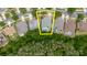 Aerial view of a home with pool, nestled in a neighborhood between the street and green area at 10292 Kristen Park Dr, Orlando, FL 32832