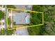 An aerial view highlighting the property, featuring a private screened pool and lush greenery for enhanced privacy at 10292 Kristen Park Dr, Orlando, FL 32832