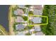 Aerial view of a home with a screened pool and a lush green backyard bordering a natural area at 10292 Kristen Park Dr, Orlando, FL 32832