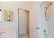 Bright bathroom features a shower and tub combination behind a partial door at 10292 Kristen Park Dr, Orlando, FL 32832