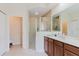 Bathroom featuring a glass-enclosed shower and large vanity with neutral colors at 10292 Kristen Park Dr, Orlando, FL 32832