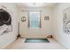 Bright bedroom with a ceiling fan, window, and themed wall art, offering a serene retreat at 10292 Kristen Park Dr, Orlando, FL 32832