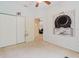 Cozy bedroom features a ceiling fan, closet, and themed wall art at 10292 Kristen Park Dr, Orlando, FL 32832