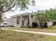 Charming single-story home with columns, a well-manicured lawn, and a three-car garage at 10292 Kristen Park Dr, Orlando, FL 32832