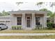 The property features columns, a well-manicured lawn, and a three-car garage at 10292 Kristen Park Dr, Orlando, FL 32832
