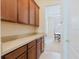 Traditional kitchen pantry cabinets with light counters at 10292 Kristen Park Dr, Orlando, FL 32832