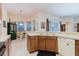 Traditional kitchen with breakfast nook, stainless sink and dishwasher and tile floors at 10292 Kristen Park Dr, Orlando, FL 32832