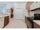 The kitchen boasts modern appliances, ample cabinet space, and a functional design for everyday cooking at 10292 Kristen Park Dr, Orlando, FL 32832
