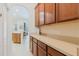 Traditional kitchen pantry cabinets with light counters and kitchen doorway at 10292 Kristen Park Dr, Orlando, FL 32832