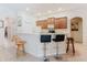 Kitchen features breakfast bar, tiled floors, and modern appliances at 10292 Kristen Park Dr, Orlando, FL 32832