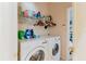 Bright laundry room with washer, dryer and storage at 10292 Kristen Park Dr, Orlando, FL 32832