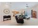 Bright living room featuring tile flooring, a ceiling fan, and sliding glass doors to let the natural light pour in at 10292 Kristen Park Dr, Orlando, FL 32832