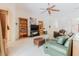 Comfortable Gathering room with bookshelves, TV, an open layout, and lots of natural light creating an inviting space at 10292 Kristen Park Dr, Orlando, FL 32832