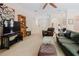 The Gathering room features plush furniture, a large TV, and carpet flooring for a cozy and inviting space at 10292 Kristen Park Dr, Orlando, FL 32832