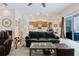 Spacious living room boasts an open floor plan, plush seating, and views into the adjacent kitchen at 10292 Kristen Park Dr, Orlando, FL 32832