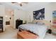 Bright and airy main bedroom featuring tray ceiling and doorway to en suite bathroom at 10292 Kristen Park Dr, Orlando, FL 32832
